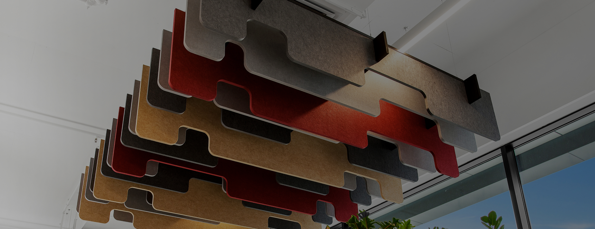 Colourful acoustic panels hanging decoratively